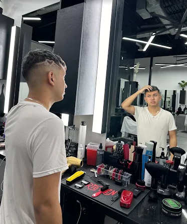 Barber at work in front of mirror